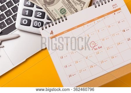 April Of The Year Is Tax Day, Top View Flat Lay Closeup Calculator, Laptop Computer, Calendar, And D