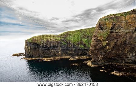 Gorgeous View Of The Cliff Across From The Whaligoe Steps In Northern Scotland, United Kingdom.