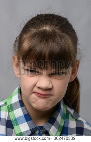 Portrait Of A Vile Ten-year-old Girl Of European Appearance, Close-up