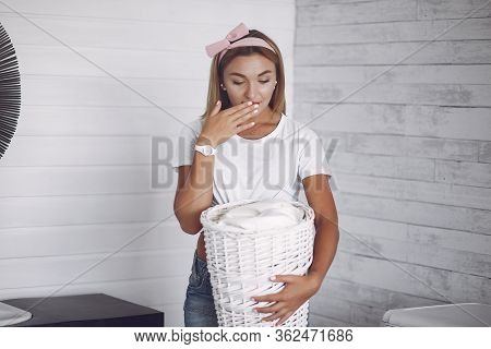 Woman In A Bathroom Near Wash Mashine