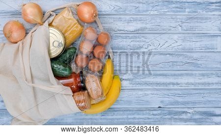 Textile Grocery Bag With Food On Wooden Background, Copy Space. Food Supplies, Fruit, Vegetables, Pa