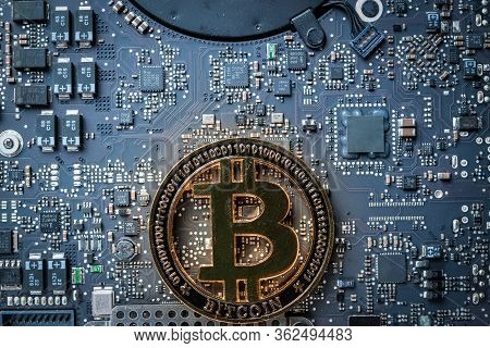 Cryptocurrency Background. Gold Bitcoin Computer Electronic Circuit Board Motherboard. Cryptocash Mi