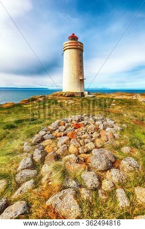 Stunning View Of Skarsviti Lighthouse In Vatnsnes Peninsula On A Sunny Day In North Iceland. Locatio