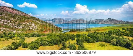 Awesome View Of Skadar Lake Surrounded By Green Mountain Peaks On A Sunny Day. Location: National Pa
