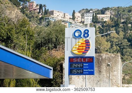 Sicily - February 11, 2020: The Logo Of Q8 Gas Station On A Banner With Prices Of Gasoline And Diese