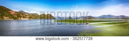Awesome View Of Skadar Lake Surrounded By Green Mountain Peaks On A Sunny Day. Location: National Pa