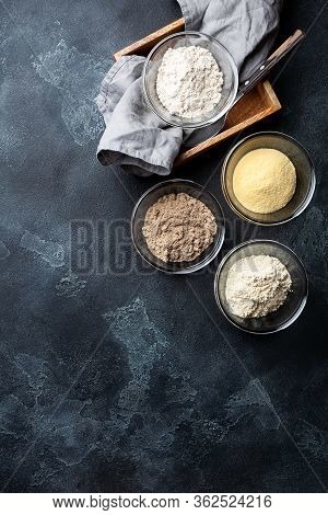 Various Vegetable Gluten Free Flour Corn,sesame,oat,coconut In Glass Bowl On Dark Gray Background.al