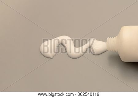Drop Of Hand Cream, Cosmetik Body Lotion Moisturizer On Gray Background.