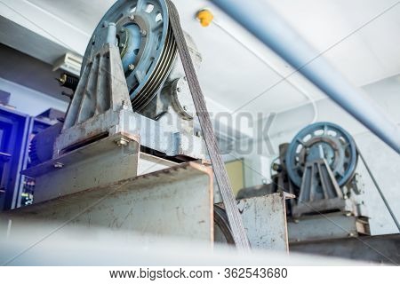 Blurry Of Wheel Rotating With Motor Driven  With Sling Cable In Control Room