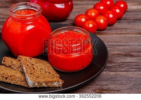 Ajvar Or Pindjur Red Vegetable Spread Pepper Mousse From Paprika And Tomatoes In Glass Jars In A Bla