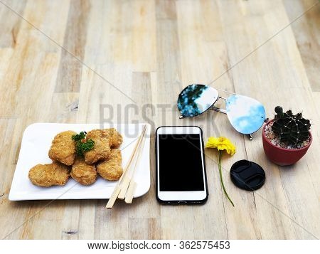 Break Time With Snack Meal, Chicken Nugget Appitizer Eating In Chilling Day Time, With Mobile, Sungl
