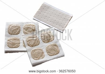 Medicinal Paper Sheets With Mustard And Pepper Plaster For The Treatment Of Colds On A White Backgro