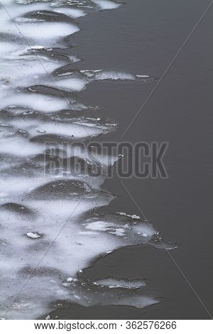 Blurred Border Of Ice Melting On The Spring River