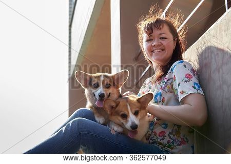 Pretty Funny Girl With Small Nice Dog Big Wall Of City House In A Sunny Day