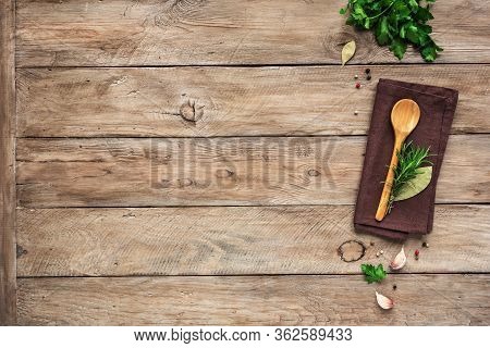 Herbs And Spices With Wooden Spoon On Wooden Background. Cooking And Healthy Eating Concept, Top Vie