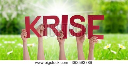 People Hands Holding Word Krise Means Crisis, Grass Meadow