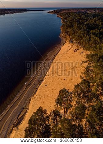 Beautiful Drone Areal Photography View Of Large Dune And Pine Forest Near River Lielupe. Photo Taken