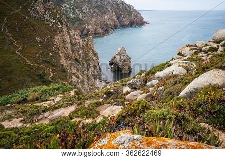 Cabo Da Roca Travel Destination Located In Sintra, Portugal. Hidden Rocky Rough Beach Surrounded By 