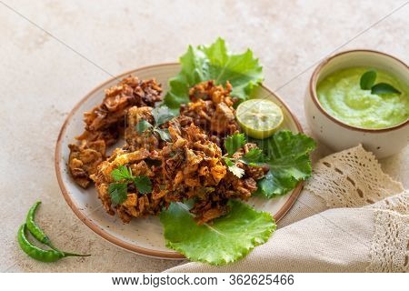 Indian Cuisine Indian Food. Pakora Traditional Indian Deep-fried Snack. Pakoras On Black Plate With 