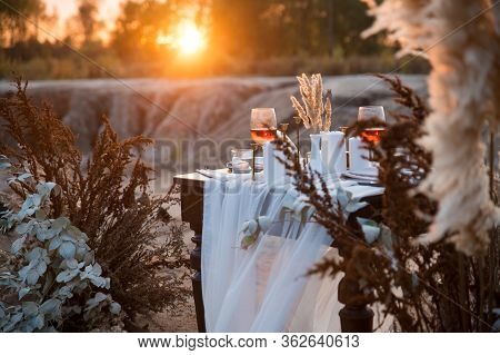 Wedding Decorations. The Wedding Ceremony Venue Is Decorated With Dried Flowers. Gala Table With Can