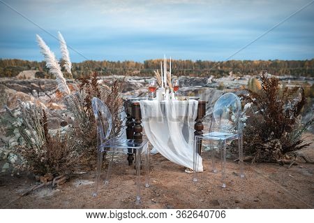 Wedding Decorations. The Venue For The Outdoor Wedding Ceremony Is Decorated With A Composition Of D