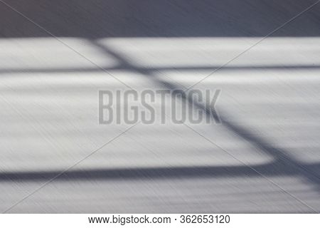 Abstract Shadow Background In The Form Of Horizontal And Vertical Lines On A White Wooden Background