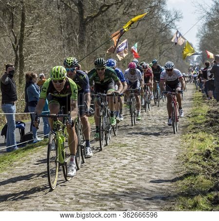 Wallers,france - April 12,2015: The Peloton Riding On A Cobblestone Road During The Paris Roubaix 20