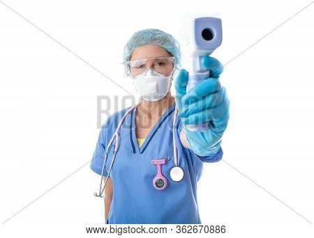 Medical Nurse Healthcare Worker Taking A Temperature Check For Fever With Infrared Thermometer