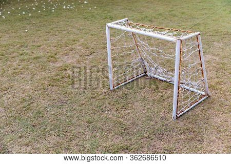 Mini Soccer Goal On The Green Grass Field. Outdoors Mini Football Court. Mini Football Goal.