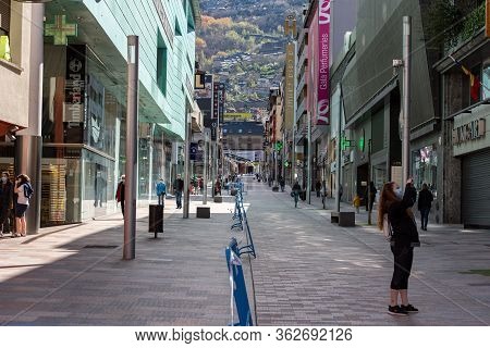 Escaldes Engordany, Andorra : 23 April 2020 : People In The Street Whit Symbols On The Covid-19 In E