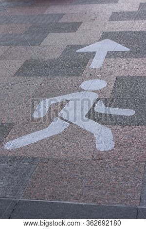 Symbols Walk In This Direction, On The Street Along The Covid-19 In Escaldes Engordany In Andorra.