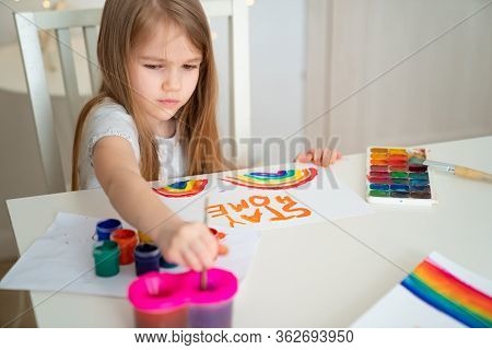Child With Blond Hair Drew A Rainbow And A Poster Stay Home. Flashmob Chasetherainbow.