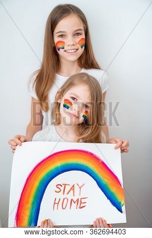 Two Kid Girls With Blond Hair Drew A Rainbow And A Poster Stay Home. Flashmob Chasetherainbow.