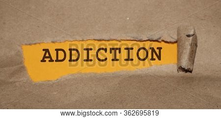 Addiction Word Under Brown Torn Paper . Stop Smoking Quit Drinking Refuce Gaming And Gambling Concep