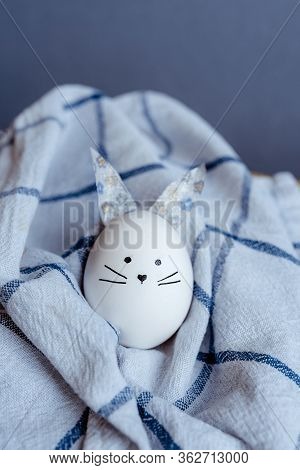 Easter Holiday Concept With Cute Handmade Egg Bunny. Frame With Copy Space For Text. One Easter Egg 