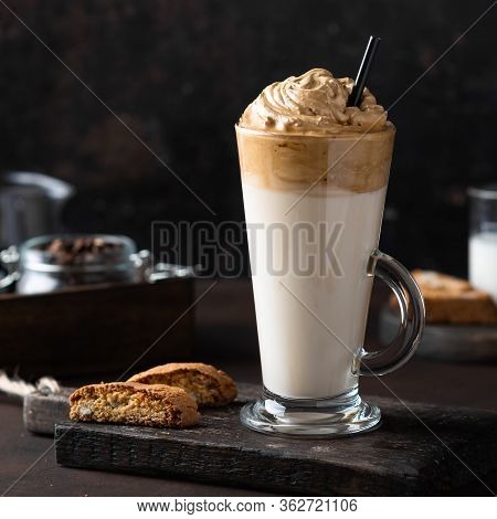 Trendy Korean Whipped Coffee Dalgona On A Dark Background.