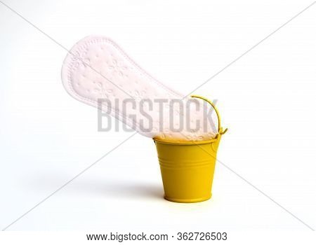 White Feminine Sanitary Pad Neatly Thrown Into An Impromptu Bin