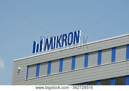 Agno, Ticino, Switzerland - 23rd April 2020 : Logo Of Mikron Group Company. Mikron Develops, Produce