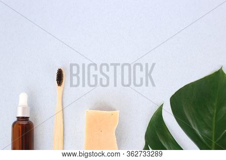 The Concept Of Zero Waste. Bamboo Toothbrush, Solid Shampoo And Serum