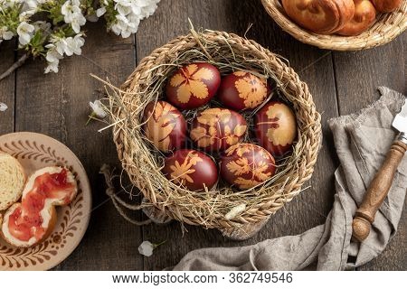 Easter Eggs Dyed With Onion Peels In A Basket, With Jidasky Or Jidase, Traditional Czech Sweet Pastr