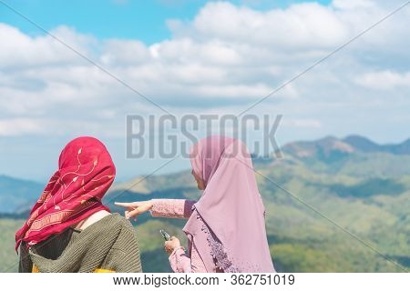 Kanchanaburi Thailand - January 1 : Unidentified Muslim Women Relax And Admire The Beautiful Scenery