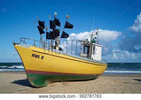 Rewal, Poland - September 02, 2019: Fishing Boat On The Beach Of The Polish Baltic Coast Near Rewal
