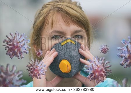 Woman wearing a real anti-pollution and anti-viruses face mask outside. SARS COVID-19 pandemic concept