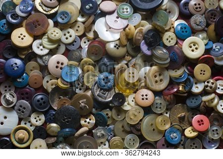 A Group Of Old Colored Buttons In A Textile Workshop