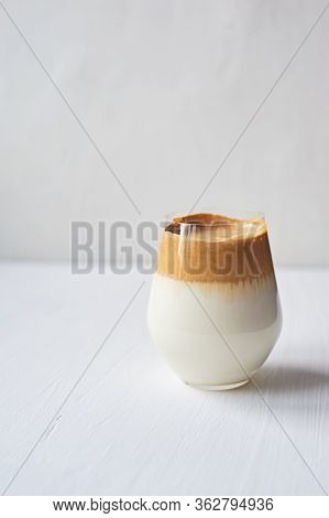 Cold Coffee Cream With Cold Dalgon Milk. Trend. In A Transparent Glass On A White Background.