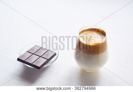 Cold Coffee Cream With Cold Dalgon Milk. Trend. In A Transparent Glass On A White Background.