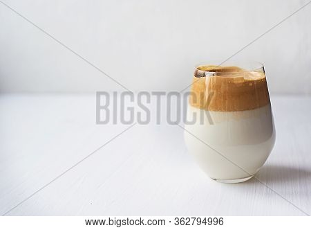Cold Coffee Cream With Cold Dalgon Milk. Trend. In A Transparent Glass On A White Background.