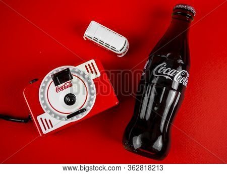 Atlanta, Georgia, Usa April 1, 2020: Coca-cola Contour Bottle, Cap, Branded Camera Vintage Die Cast 