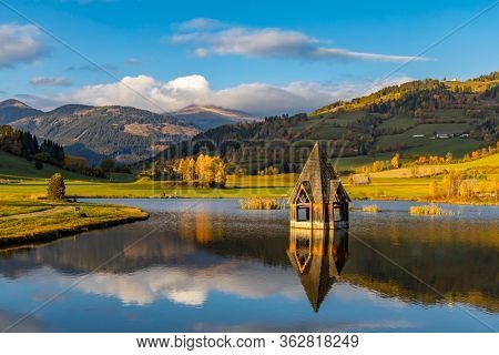 autumn pond under the mountains, Murau district,
Styria, Austria