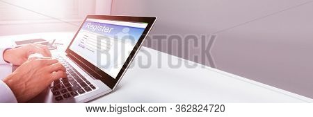 Filling Website Online Registration Form On Laptop Screen